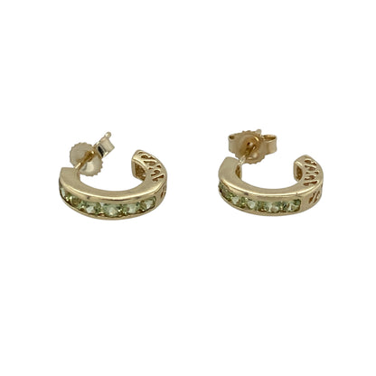 Add fresh gemstone colour and classic styling to your jewellery collection with these pre-owned 9ct yellow gold and peridot half hoop stud earrings, featuring an elegant curved profile with vibrant green gemstone detailing.

Design: The earrings showcase a classic half hoop stud design enhanced with peridot stones, creating an elegant curved profile with attractive colour and timeless appeal.