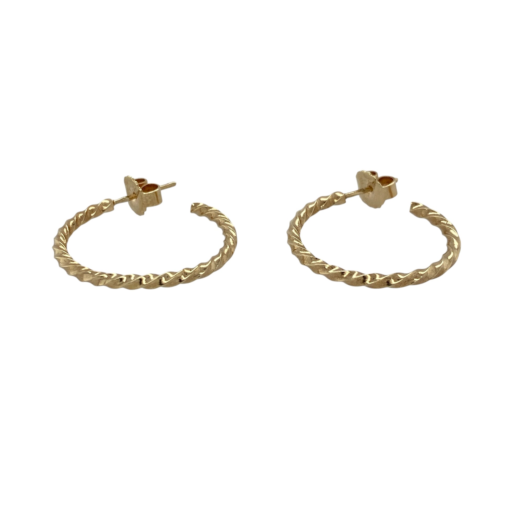 Add classic gold styling and elegant texture to your jewellery collection with these pre-owned 9ct yellow gold twisted half hoop earrings, featuring a distinctive curved design with timeless appeal.

Design: The earrings showcase a classic half hoop profile enhanced with an attractive twisted design, creating texture, depth and visual interest while retaining a versatile and timeless appearance.
