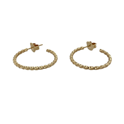 Add classic gold styling and elegant texture to your jewellery collection with these pre-owned 9ct yellow gold twisted half hoop earrings, featuring a distinctive curved design with timeless appeal.

Design: The earrings showcase a classic half hoop profile enhanced with an attractive twisted design, creating texture, depth and visual interest while retaining a versatile and timeless appearance.
