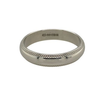 Bring classic sophistication and understated elegance to your jewellery collection with this pre-owned 9ct white gold milgrain edge wedding band ring, featuring a timeless 4mm profile and decorative detailing—perfect as a traditional wedding ring, anniversary band, or elegant everyday piece.

Design: The ring features a classic 4mm wide wedding band design, enhanced by fine milgrain edge detailing that adds subtle texture and a refined vintage-inspired finish.