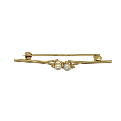 Add timeless elegance and classic sophistication to your jewellery collection with this pre-owned 9ct yellow gold and pearl brooch, featuring two lustrous pearls and a traditional gold design—perfect for accessorising jackets, scarves, dresses, or adding a refined finishing touch to formal outfits.

Design: The brooch features an elegant yellow gold design accented with two round pearls, creating a classic and sophisticated appearance with timeless appeal.