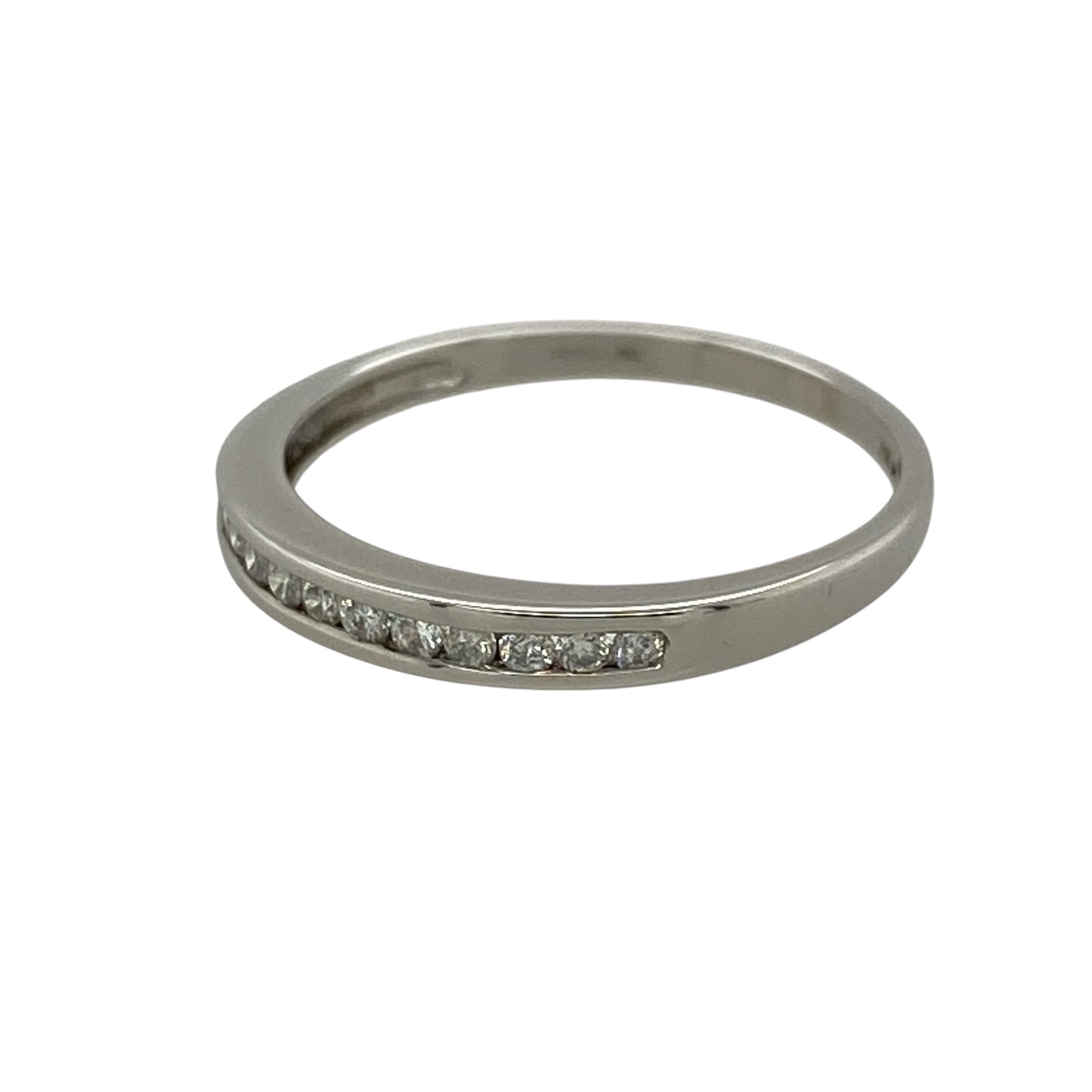 Add refined sparkle and timeless elegance to your jewellery collection with this pre-owned 9ct white gold and diamond band ring, featuring a slim profile and approximately 0.15ct of diamond content—perfect as a diamond wedding band, eternity-style ring, stacking ring, or elegant everyday piece.

Design: The ring features a classic slim band design accented with sparkling diamonds across the front, creating an understated and elegant appearance that can be worn alone or paired with other rings.