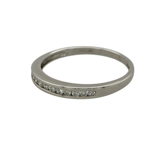Add refined sparkle and timeless elegance to your jewellery collection with this pre-owned 9ct white gold and diamond band ring, featuring a slim profile and approximately 0.15ct of diamond content—perfect as a diamond wedding band, eternity-style ring, stacking ring, or elegant everyday piece.

Design: The ring features a classic slim band design accented with sparkling diamonds across the front, creating an understated and elegant appearance that can be worn alone or paired with other rings.