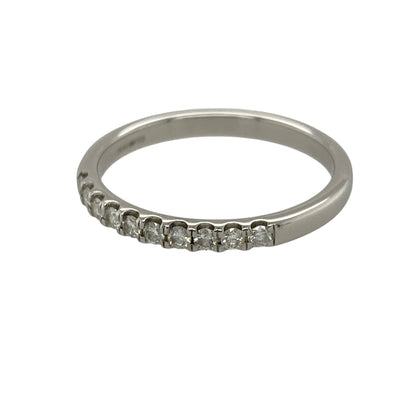 Add refined sparkle and timeless elegance to your jewellery collection with this pre-owned 18ct white gold and diamond band ring, featuring a sleek profile and approximately 0.25ct of diamond content—perfect as a diamond wedding band, anniversary ring, stacking ring, or sophisticated everyday piece.

Design: The ring features a classic diamond band design with a slim front profile, creating an elegant and versatile appearance that can be worn alone or paired with an engagement ring or other bands.