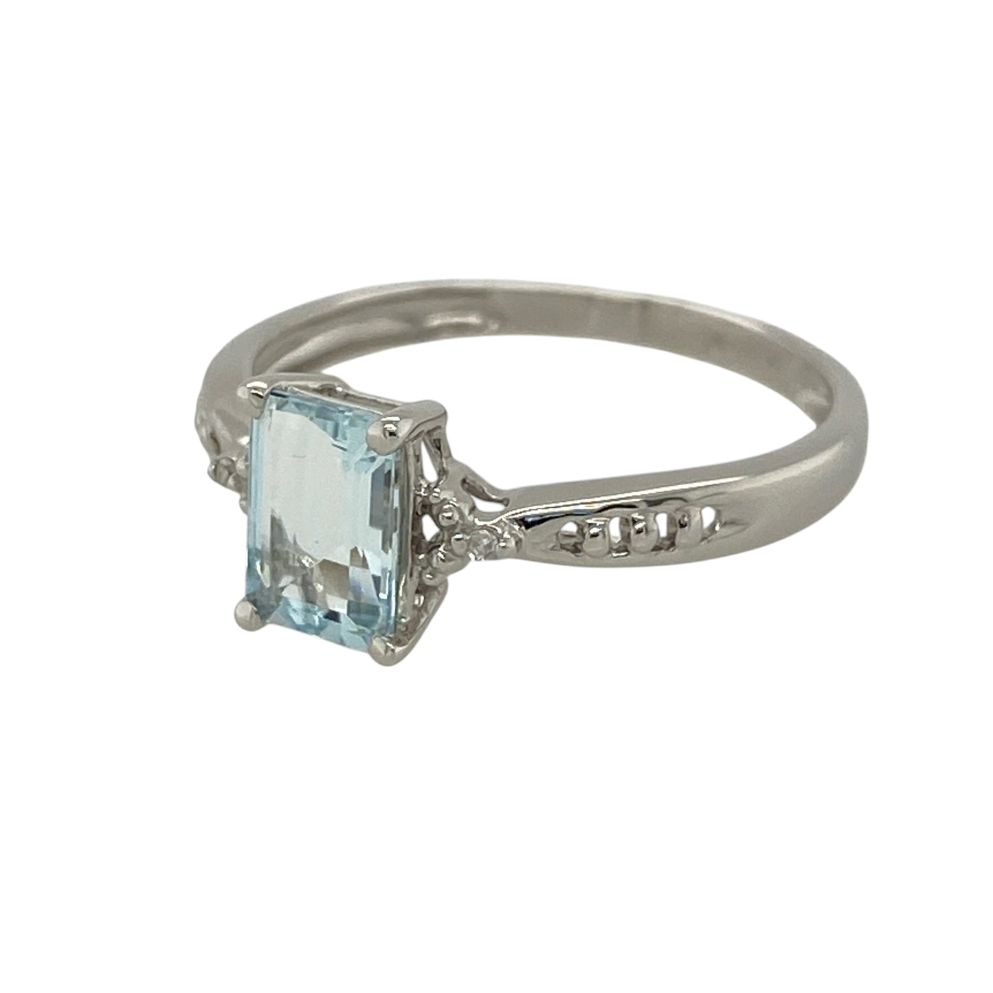 Add refreshing colour and delicate sparkle to your jewellery collection with this pre-owned 9ct gold diamond and aquamarine ring, featuring a rectangular aqua-coloured stone accented by diamonds—perfect as a gemstone dress ring, birthday gift, anniversary present, or elegant everyday piece.

Design: The ring features a rectangular aquamarine stone at the centre, complemented by a small diamond on either side to create a balanced and elegant three-stone inspired design.