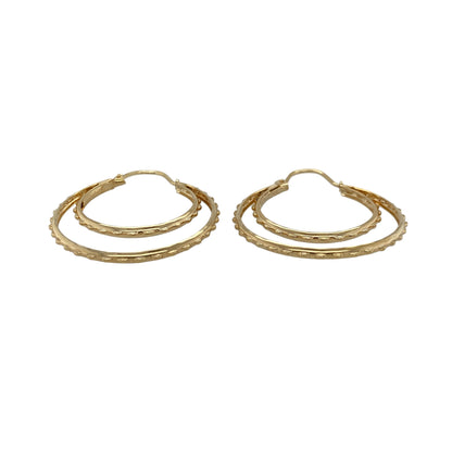 Add texture and timeless style to your jewellery collection with these pre-owned 9ct yellow gold textured double hoop Creole earrings, featuring a layered hoop design and decorative finish—perfect for everyday wear, special occasions, or adding a distinctive touch to any outfit.

Design: The earrings feature an eye-catching double hoop Creole design, combining two curved sections with textured detailing to create a stylish layered appearance.