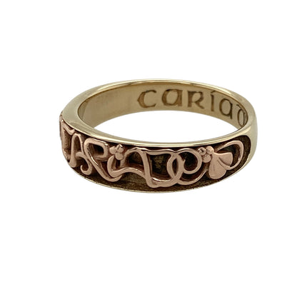 Add a touch of Welsh heritage and timeless romance to your jewellery collection with this pre-owned 9ct yellow and rose gold Clogau Cariad band ring, featuring an iconic design with elegant everyday appeal—perfect for gifting, anniversaries, or meaningful daily wear.

Design: The ring features the distinctive Cariad design across a substantial 7mm wide band, creating a striking and instantly recognisable look.