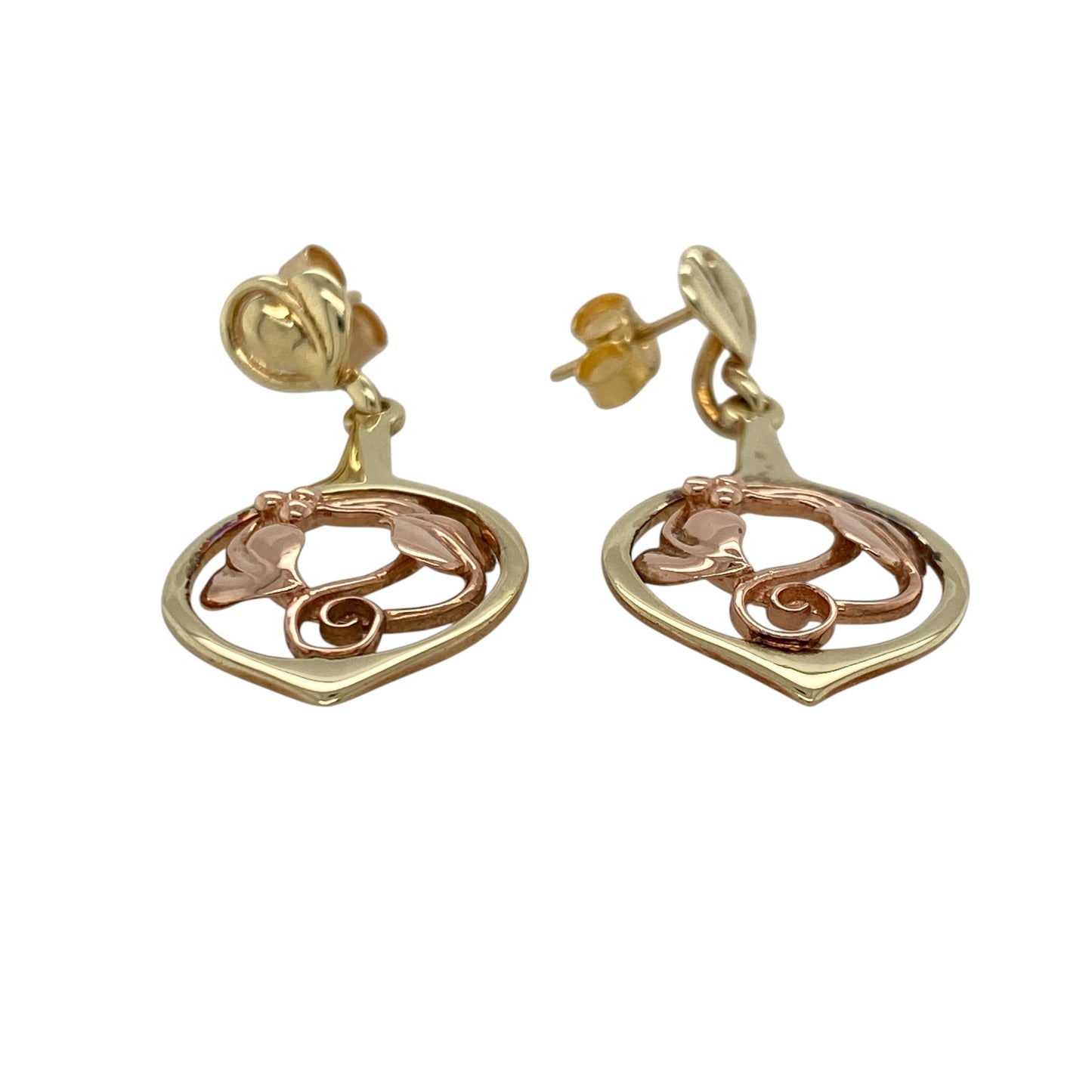 Bring symbolic beauty and graceful detail to your collection with these pre-owned 9ct yellow and rose gold Clogau Tree of Life drop earrings—a meaningful design inspired by nature and connection.

Design: Each earring features the iconic Tree of Life motif, combining flowing vines and leaves in a delicate openwork drop style.
Material: Made from 9-carat yellow and rose gold, the contrasting tones highlight the intricate design and signature Clogau detail.