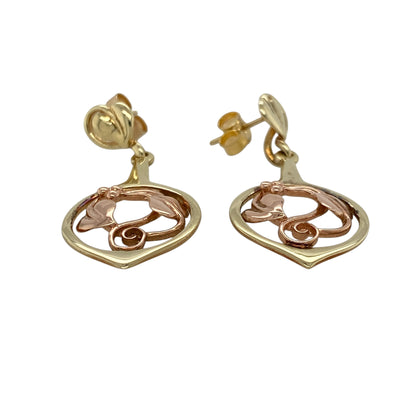Bring symbolic beauty and graceful detail to your collection with these pre-owned 9ct yellow and rose gold Clogau Tree of Life drop earrings—a meaningful design inspired by nature and connection.

Design: Each earring features the iconic Tree of Life motif, combining flowing vines and leaves in a delicate openwork drop style.
Material: Made from 9-carat yellow and rose gold, the contrasting tones highlight the intricate design and signature Clogau detail.