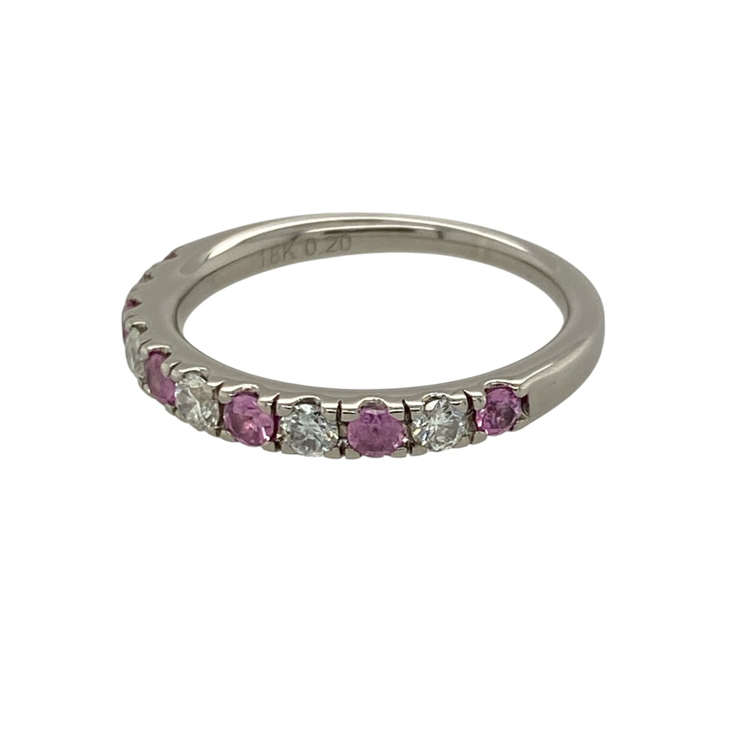 Add vibrant colour and luxurious sparkle to your jewellery collection with this pre-owned 18ct white gold diamond and pink sapphire band ring, featuring delicate pink gemstones and approximately 0.20ct of total diamond content—perfect as an anniversary ring, wedding band, stacking ring, or elegant piece for special occasions.

Design: The ring features an elegant band design combining round pink sapphire stones with sparkling diamonds, creating an eye-catching contrast of soft pink colour