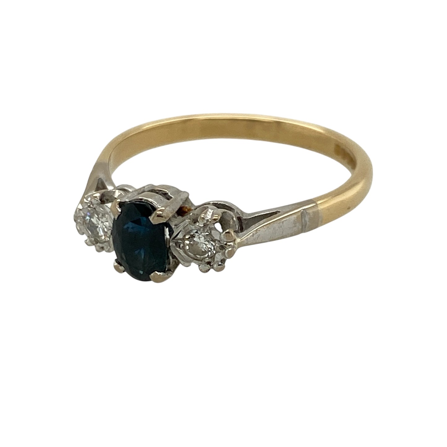 Add timeless colour and refined sparkle to your jewellery collection with this pre-owned 18ct yellow gold diamond and sapphire trilogy ring, featuring a classic oval sapphire flanked by two sparkling diamonds—perfect as an engagement ring, anniversary gift, romantic present, or elegant piece of fine jewellery.

Design: The ring features a traditional trilogy design centred with an oval sapphire and complemented by a diamond on either side