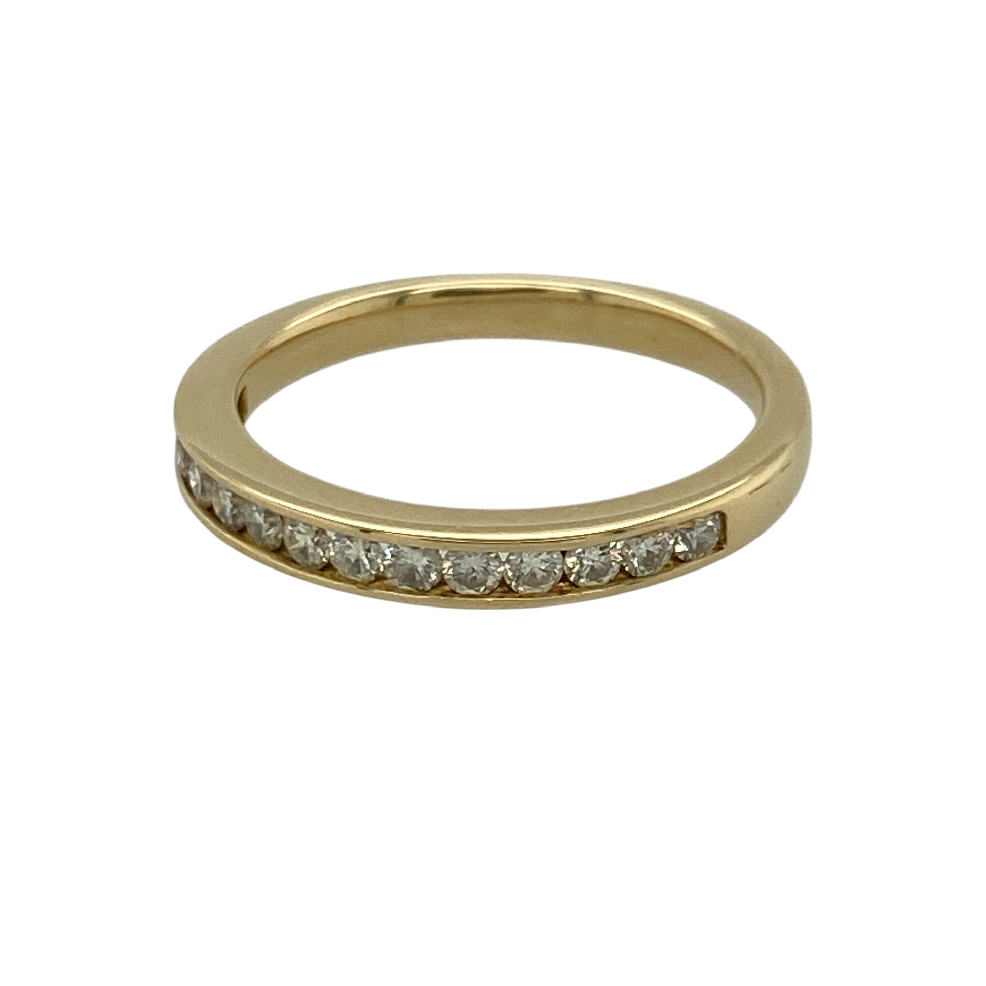 Add timeless sparkle and refined luxury to your jewellery collection with this pre-owned 18ct yellow gold and diamond band ring, featuring a sleek profile and approximately 0.30ct of total diamond content—perfect as a diamond wedding band, anniversary ring, stacking ring, or elegant piece for everyday wear and special occasions.

Design: The ring features a classic diamond band design with sparkling diamonds arranged across the front, creating an elegant and versatile appearance