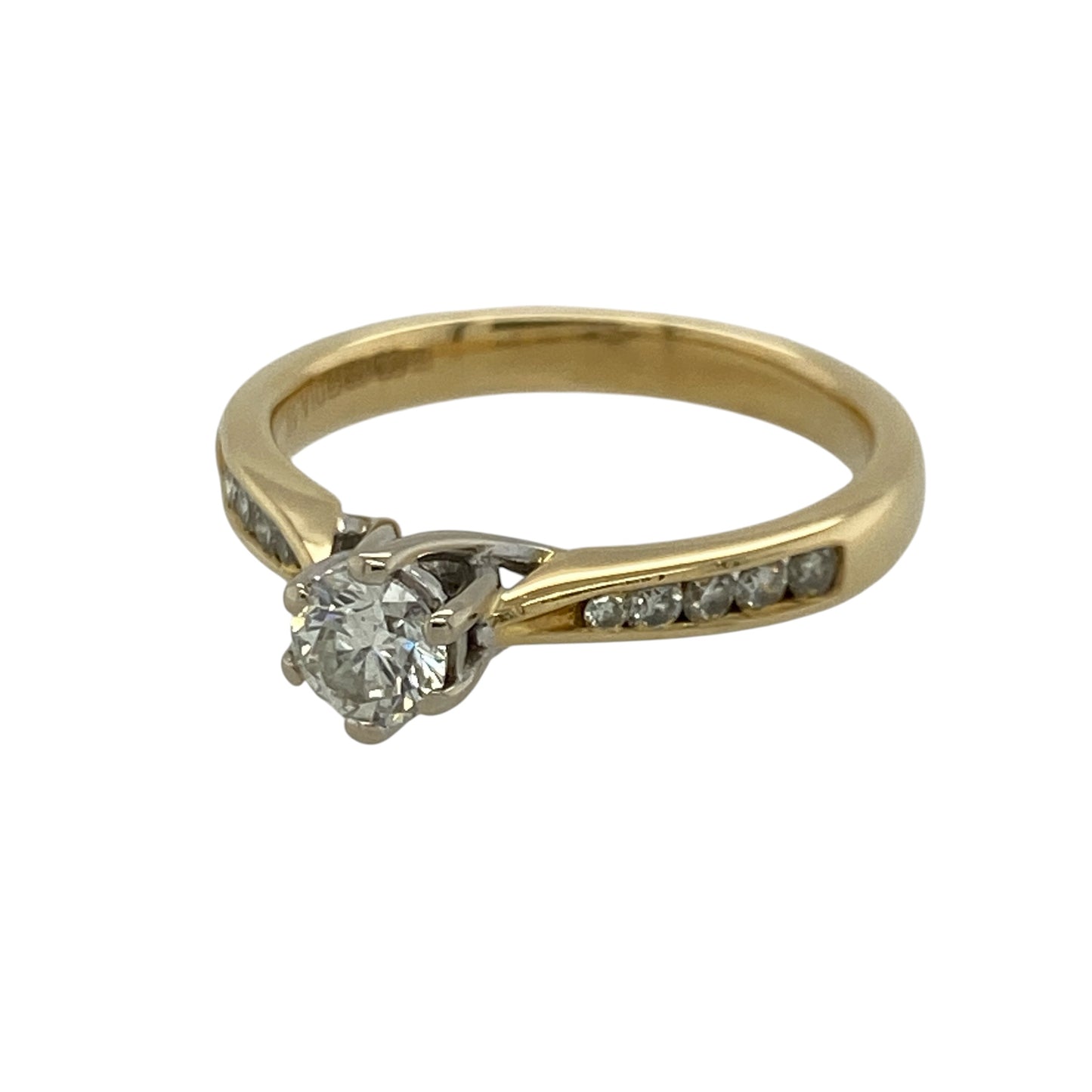Add timeless sparkle and luxurious elegance to your jewellery collection with this pre-owned 18ct yellow gold and diamond solitaire ring, featuring a brilliant-cut centre diamond and additional diamond detailing along the shoulders with approximately 0.50ct of total diamond content—perfect as an engagement ring, anniversary gift, proposal ring, or sophisticated piece of fine jewellery.

Design: The ring features a classic solitaire-inspired design centred with a brilliant-cut diamond