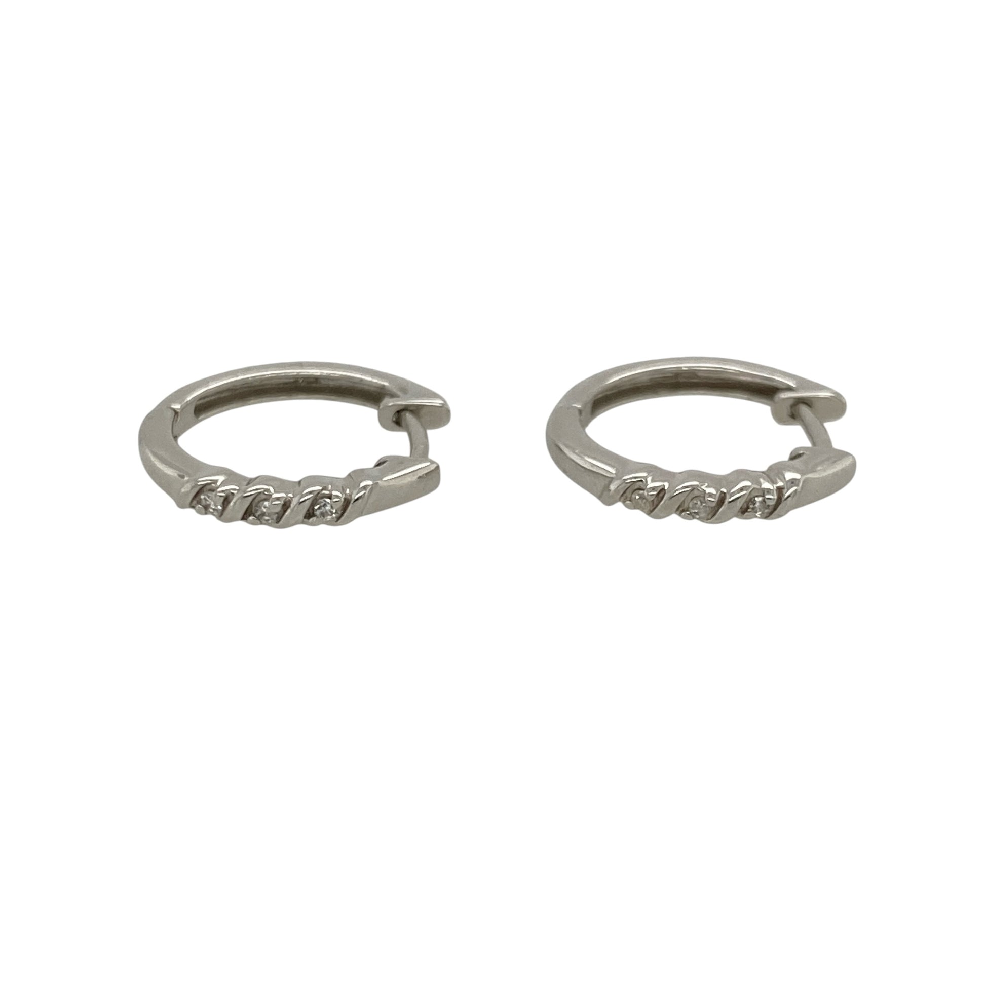 Add timeless sparkle and versatile elegance to your jewellery collection with these pre-owned 9ct white gold and diamond small hoop earrings, featuring a classic design enhanced by sparkling diamond detail—perfect for everyday wear, special occasions, or adding refined sparkle to any outfit.

Design: The earrings feature a classic small hoop design accented with diamonds, creating an elegant and versatile appearance that can be worn alone or paired with other white gold jewellery.