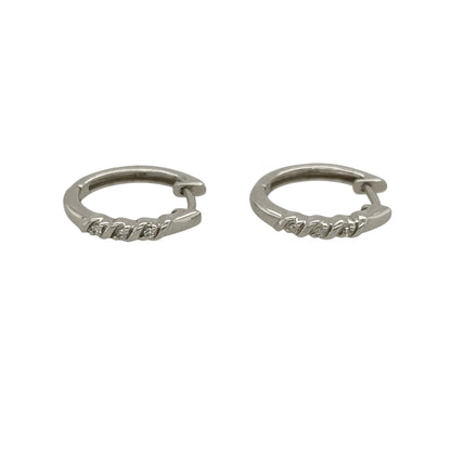 Add timeless sparkle and versatile elegance to your jewellery collection with these pre-owned 9ct white gold and diamond small hoop earrings, featuring a classic design enhanced by sparkling diamond detail—perfect for everyday wear, special occasions, or adding refined sparkle to any outfit.

Design: The earrings feature a classic small hoop design accented with diamonds, creating an elegant and versatile appearance that can be worn alone or paired with other white gold jewellery.