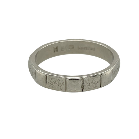 Add timeless style and lasting durability to your jewellery collection with this pre-owned platinum 4mm patterned square style band ring, featuring a distinctive geometric profile and decorative finish—perfect as a wedding band, everyday ring, or sophisticated addition to a fine jewellery collection.

Design: The ring features a contemporary square style band with patterned detailing, creating a distinctive geometric appearance that offers a modern take on the classic wedding band.