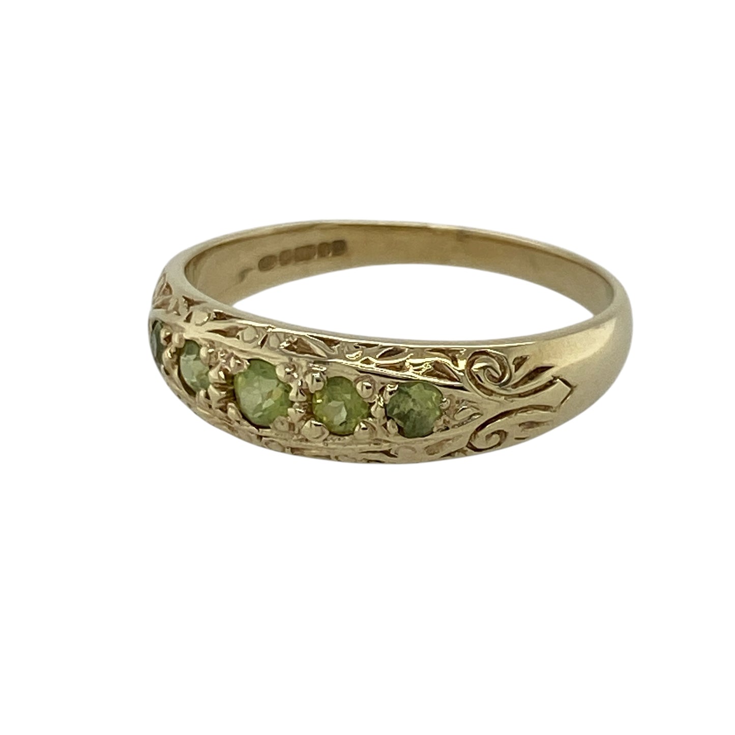 Add vibrant colour and timeless style to your jewellery collection with this pre-owned 9ct yellow gold peridot five stone patterned band ring, featuring five beautiful peridot gemstones within a decorative band design—perfect as a stacking ring, anniversary gift, dress ring, or elegant everyday jewellery.

Design: The ring features a classic five stone band design with decorative patterned detailing, showcasing five vibrant peridot gemstones for a colourful and eye-catching finish.