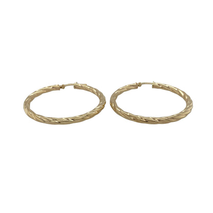 Add timeless style and elegant detail to your jewellery collection with these pre-owned 9ct yellow gold twisted hoop Creole earrings, featuring a classic twisted design that brings texture and sophistication to any look—perfect for everyday wear, special occasions, or completing your favourite jewellery collection.

Design: The earrings feature a classic Creole hoop design with an elegant twisted finish, creating a timeless look with added texture and visual interest.