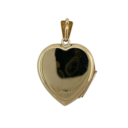 Add timeless sentiment and elegant vintage charm to your jewellery collection with this pre-owned 9ct yellow gold flower patterned heart locket, featuring a beautifully engraved floral design—perfect for keeping treasured photographs close or as a meaningful gift for someone special.

Design: The locket features a classic heart-shaped design with an attractive engraved floral pattern across the front, creating a romantic and timeless appearance that never goes out of style.
