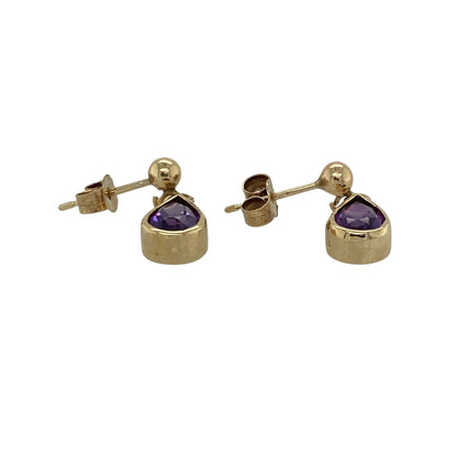 Add a touch of elegant colour to your jewellery collection with these pre-owned 9ct yellow gold and amethyst teardrop drop earrings. Featuring beautifully shaped amethyst gemstones, they are perfect for both everyday wear and special occasions.

Design: The earrings feature graceful teardrop-shaped amethyst gemstones suspended from polished yellow gold fittings, creating a timeless drop design with gentle movement.