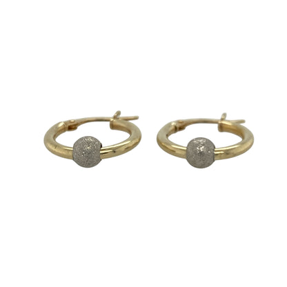 Introduce subtle sparkle to your jewellery collection with these pre-owned 9ct yellow and white gold sparkle ball creole earrings. Combining two-tone gold with textured sparkle ball detailing, they offer a timeless design that's perfect for everyday wear or special occasions.

Design: The earrings feature a classic round creole style, beautifully enhanced with decorative white gold sparkle balls that create texture, contrast, and light-catching detail.