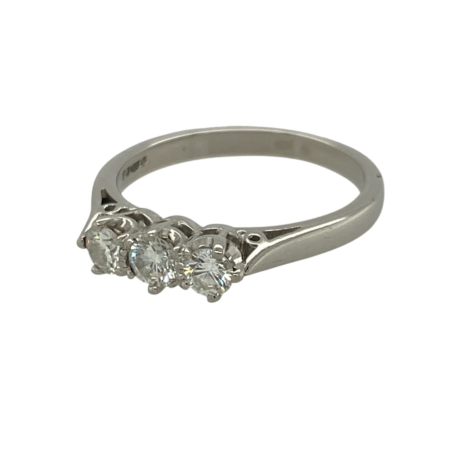Celebrate life's special moments with this elegant pre-owned platinum diamond trilogy ring. Featuring three sparkling diamonds, the classic trilogy design beautifully represents the past, present and future, making it a meaningful choice for an engagement, anniversary or special gift.

Design: The ring features a timeless trilogy setting with three diamonds arranged across the front, creating a balanced design with exceptional brilliance.