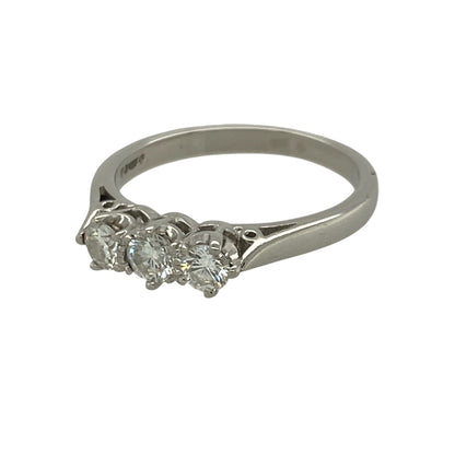 Celebrate life's special moments with this elegant pre-owned platinum diamond trilogy ring. Featuring three sparkling diamonds, the classic trilogy design beautifully represents the past, present and future, making it a meaningful choice for an engagement, anniversary or special gift.

Design: The ring features a timeless trilogy setting with three diamonds arranged across the front, creating a balanced design with exceptional brilliance.