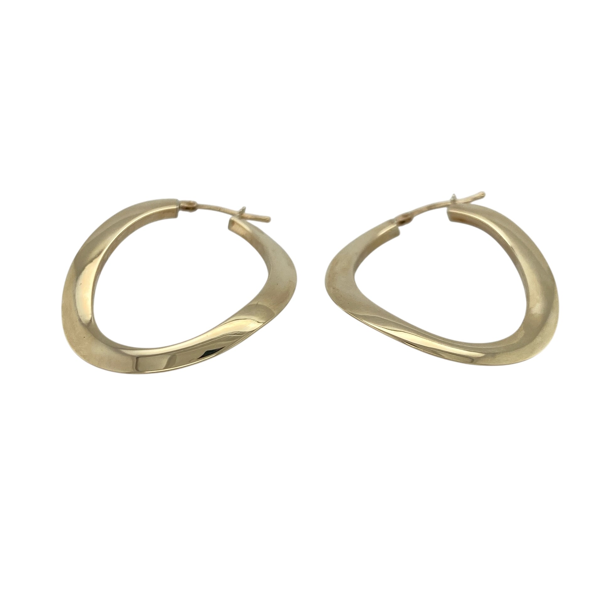 Elevate your everyday style with these pre-owned 9ct yellow gold large curved oval creole earrings, offering a timeless silhouette that complements both casual and occasion wear.

Design: These elegant creole earrings feature a large curved oval shape that creates a flattering, elongated profile, giving the classic hoop style a sophisticated and modern twist.
Material: Made from 9-carat yellow gold, the polished finish provides a warm, luxurious shine that pairs effortlessly with any jewellery collection.