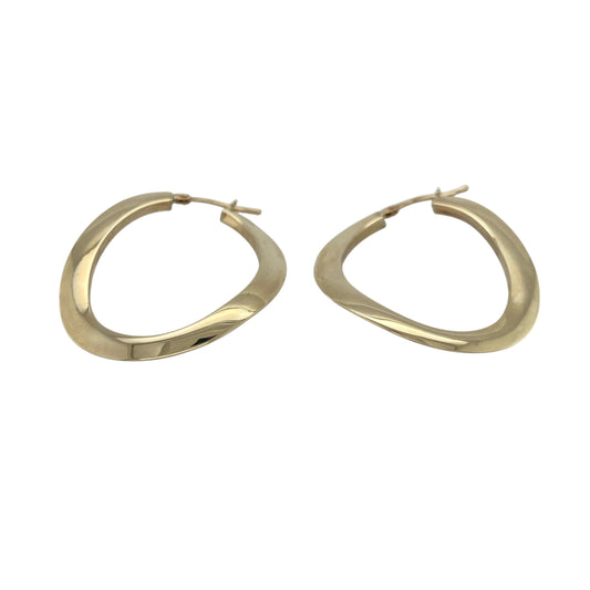 Elevate your everyday style with these pre-owned 9ct yellow gold large curved oval creole earrings, offering a timeless silhouette that complements both casual and occasion wear.

Design: These elegant creole earrings feature a large curved oval shape that creates a flattering, elongated profile, giving the classic hoop style a sophisticated and modern twist.
Material: Made from 9-carat yellow gold, the polished finish provides a warm, luxurious shine that pairs effortlessly with any jewellery collection.