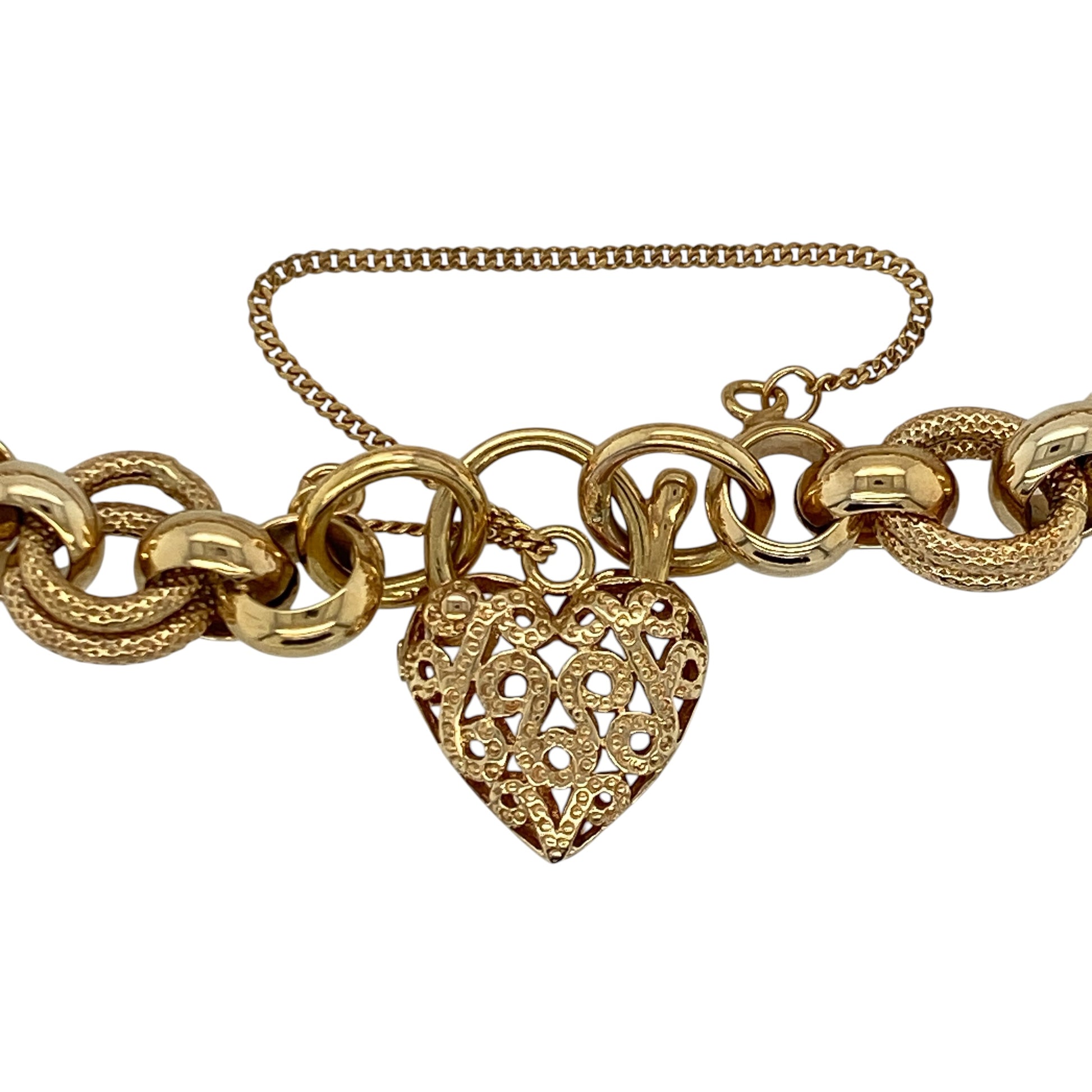 Make a statement with this pre-owned 9ct yellow gold textured belcher heart padlock bracelet, a timeless vintage-inspired piece that combines bold styling with classic elegance.

Design: This eye-catching bracelet features substantial textured belcher links finished with a traditional heart-shaped padlock clasp, creating a timeless design that has remained a favourite for generations.