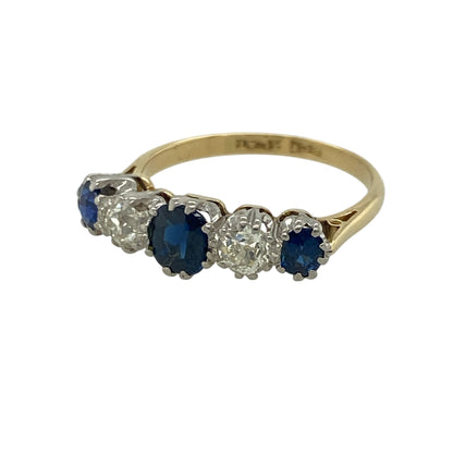 Celebrate timeless elegance with this pre-owned 18ct yellow gold diamond and sapphire five stone band ring, beautifully combining rich blue sapphires with sparkling diamonds in a classic design.

Design: This traditional five stone ring features three oval sapphires separated by two brilliant diamonds, creating a balanced and eye-catching arrangement. The combination of deep blue gemstones and bright diamonds makes this a timeless piece, perfect for both everyday wear and special occasions.