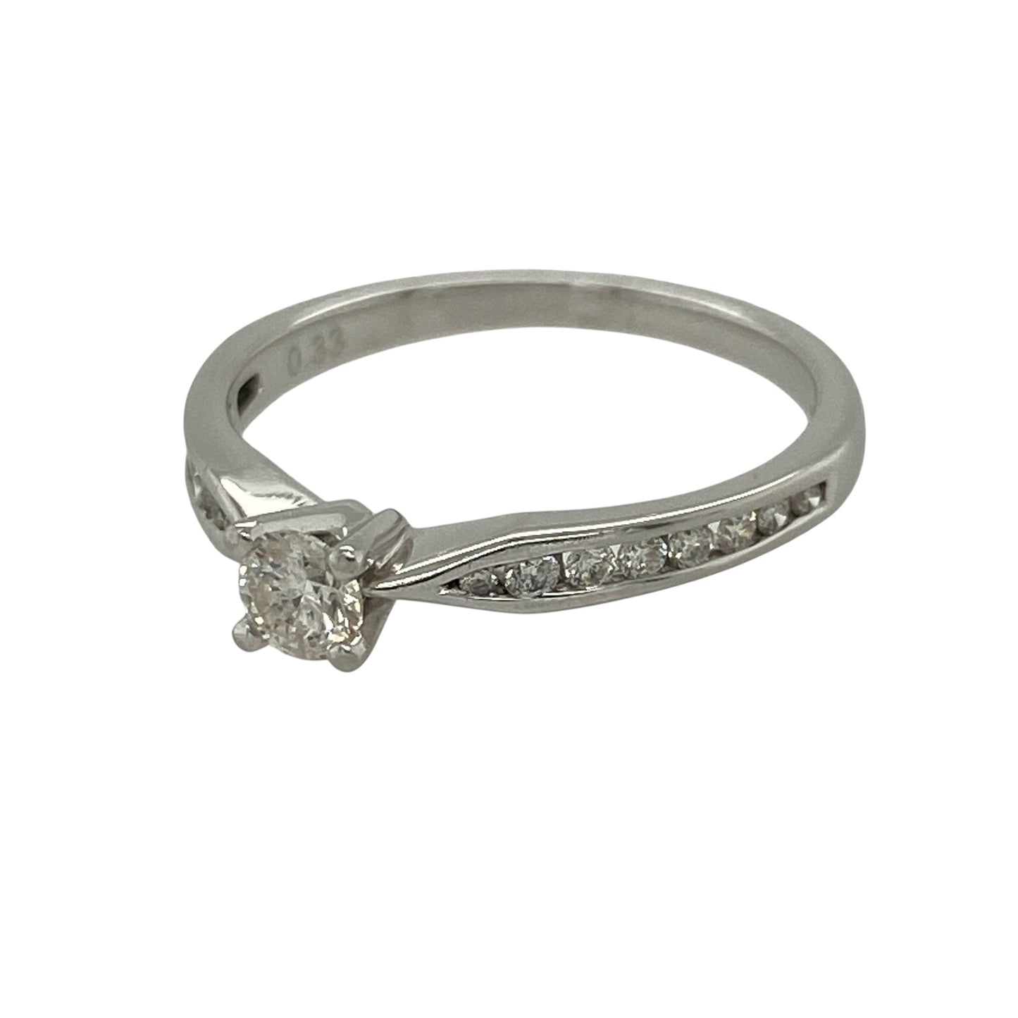 This pre-owned platinum diamond solitaire ring combines a striking princess cut centre diamond with sparkling brilliant cut shoulder diamonds, creating a timeless engagement ring with elegant modern styling.

Design: The ring features a beautiful princess cut diamond at its centre, complemented by brilliant cut diamonds set into the shoulders for added sparkle and a refined finish. Its classic solitaire design with diamond-set shoulders offers a sophisticated look that never goes out of style.