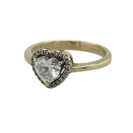 This pre-owned 9ct yellow gold cubic zirconia heart halo cluster ring is a beautiful symbol of love, featuring a sparkling heart-shaped centre stone surrounded by a halo of cubic zirconias for extra brilliance.

Design: The ring showcases a heart-shaped cubic zirconia centre stone framed by a halo of sparkling cubic zirconias, creating a timeless and eye-catching cluster design. The elegant setting gives the ring a bold yet feminine appearance.