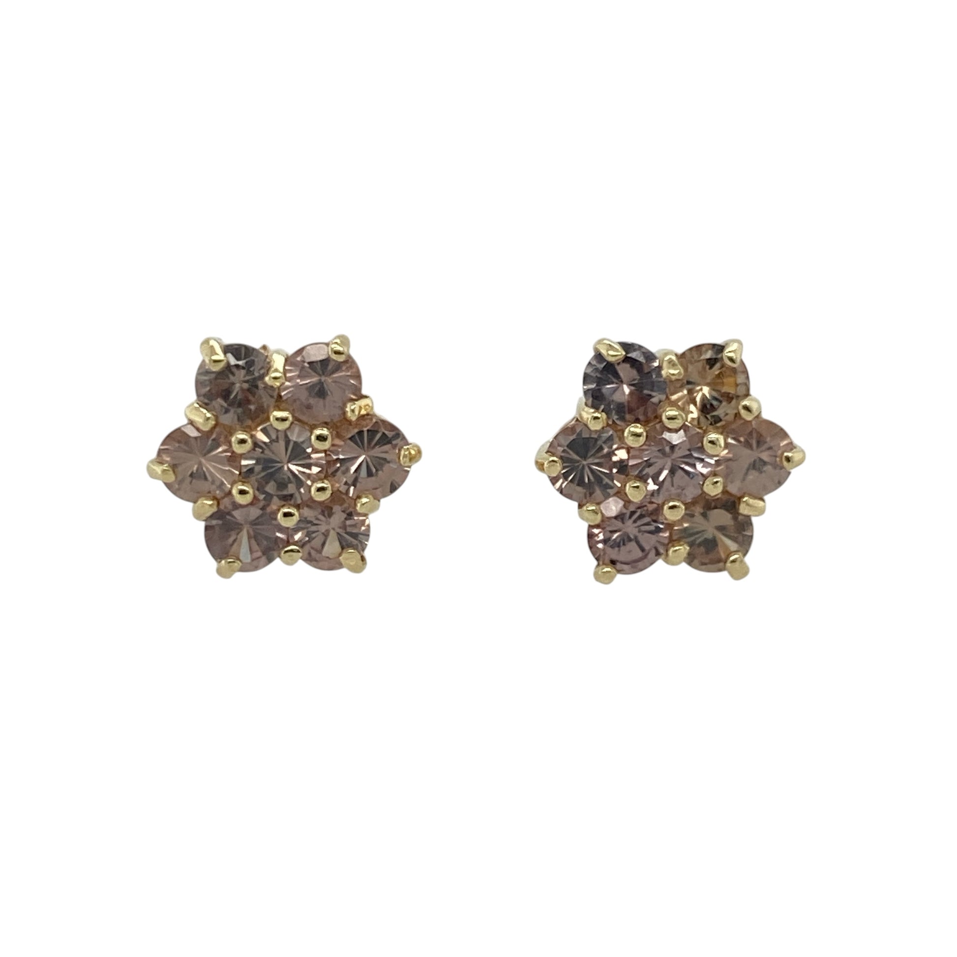 These pre-owned 9ct yellow gold flower cluster stud earrings feature beautiful grey-green stones arranged in a classic floral design, making them an elegant addition to any jewellery collection.

Design: Each stud is designed as a delicate flower cluster, set with grey-green stones that catch the light with subtle colour and sparkle. Their timeless style makes them suitable for both everyday wear and special occasions.
Material: Made from 9-carat yellow gold with grey-green stones.