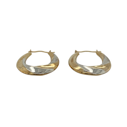 These pre-owned 9ct yellow and white gold twisted oval creole earrings combine two-tone gold with an elegant twisted design, making them a stylish addition to any jewellery collection.

Design: The earrings feature an attractive oval creole shape with intertwined yellow and white gold, creating a striking two-tone effect that complements both gold and silver jewellery. Their twisted finish adds texture and catches the light beautifully.
Material: Made from 9-carat yellow and white gold.