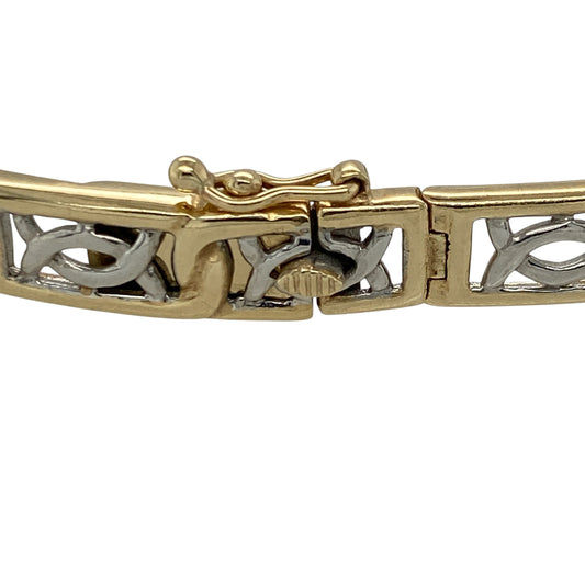 This pre-owned 9ct yellow and white gold Celtic style link bracelet features an eye-catching two-tone design with intricate Celtic-inspired links, making it a timeless piece for everyday wear or special occasions.

Design: The bracelet showcases interlocking Celtic style links in contrasting yellow and white gold, creating a classic two-tone look with a polished finish. Its distinctive design is both elegant and meaningful, making it suitable for any jewellery collection.