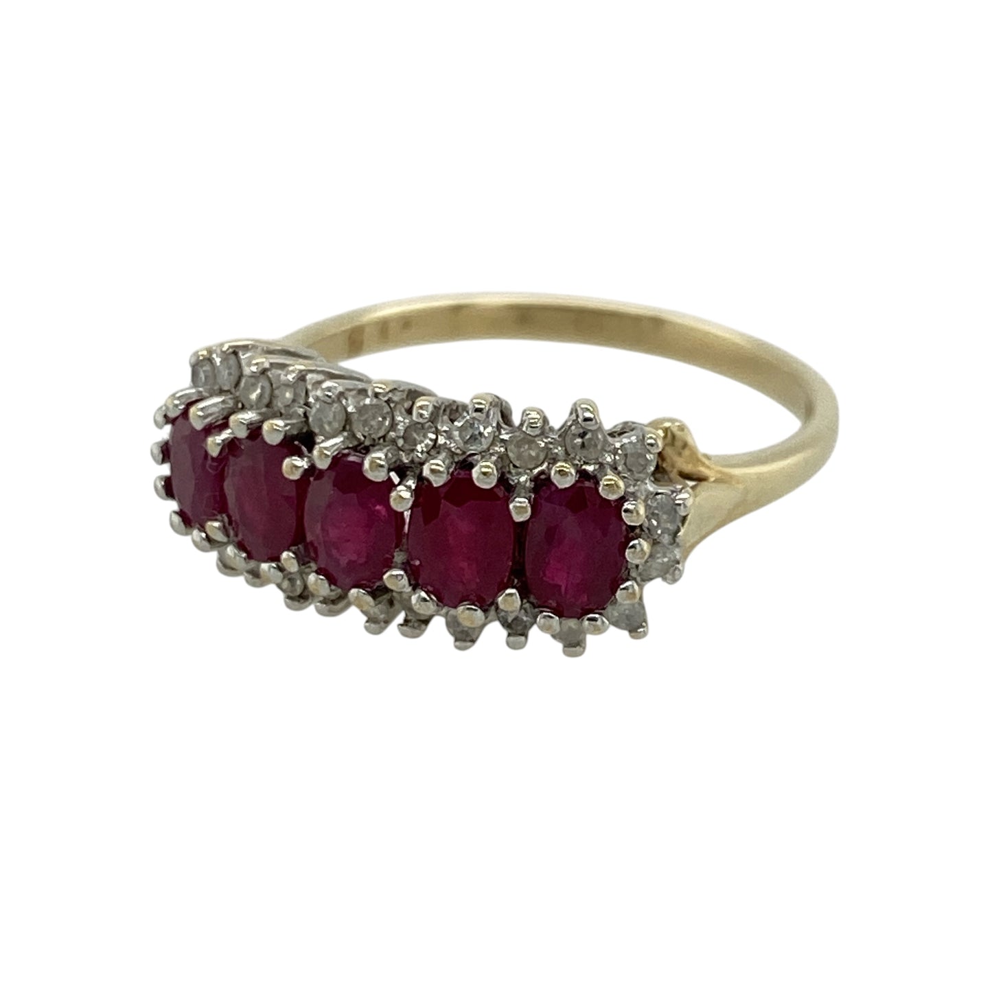This pre-owned 9ct yellow gold diamond and ruby cluster band ring is a vibrant and eye-catching piece, combining rich red rubies with the sparkle of diamonds.

Design: The ring features five oval rubies arranged across the front of the band, each surrounded by shimmering diamonds in elegant cluster settings. The colourful gemstones and classic design make it a timeless choice for everyday wear or special occasions.
Material: Made from 9-carat yellow gold.