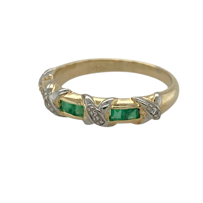 This pre-owned 9ct yellow gold diamond and emerald band ring combines the rich green tones of emeralds with the brilliance of diamonds in a timeless design.

Design: The ring features alternating emeralds and diamonds set across the front of the band, creating a classic and elegant look. With its approximately 4mm wide front, it offers a comfortable fit while adding a touch of colour and sparkle to any jewellery collection.
Material: Made from 9-carat yellow gold.