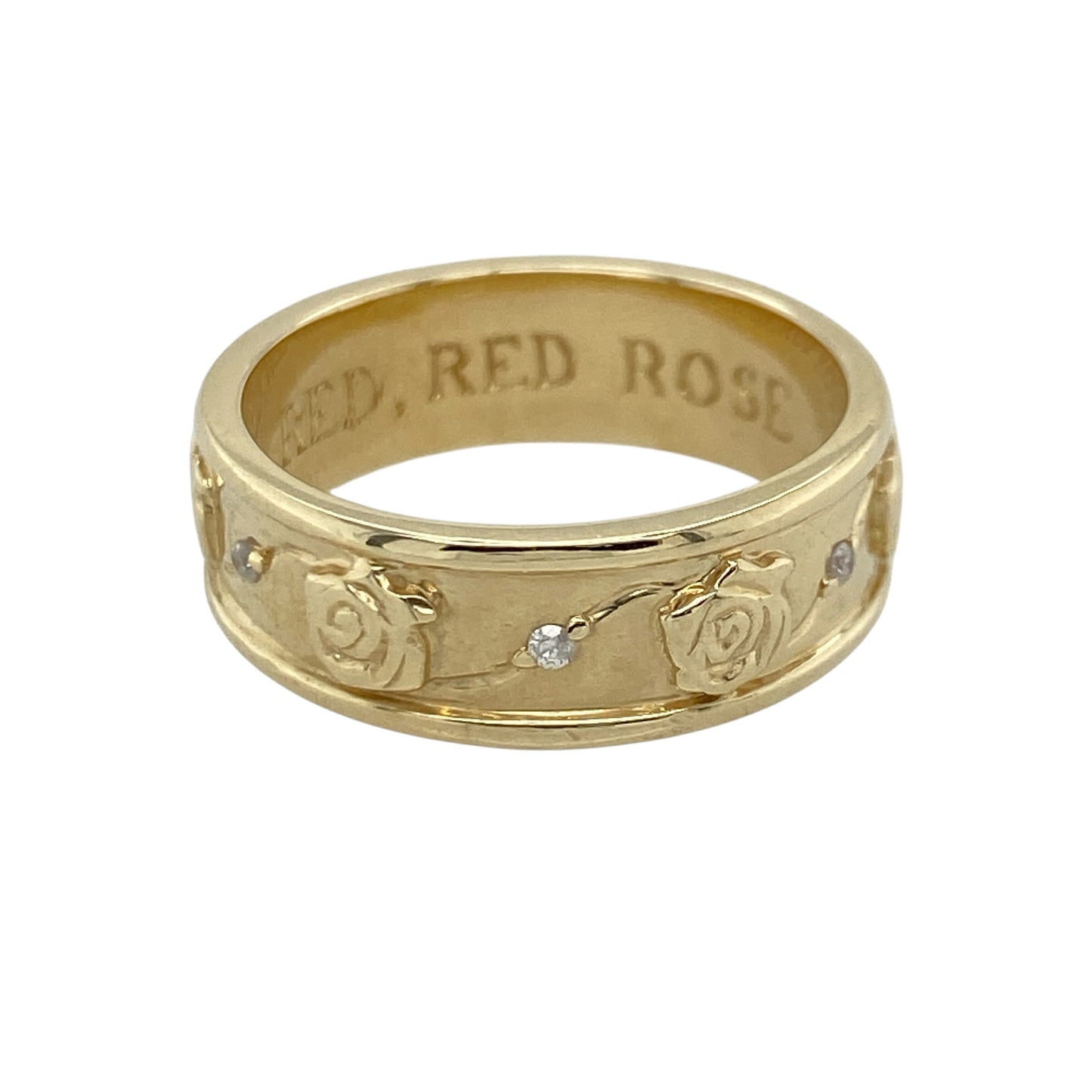 This pre-owned 9ct yellow gold diamond rose flower patterned band ring is a beautifully detailed piece, combining floral design with subtle diamond accents.

Design: The 6mm wide band is decorated with an intricate pattern of rose flowers all the way around, with a small sparkling diamond set between each rose. The continuous floral design creates a unique and eye-catching ring, perfect for everyday wear or as a distinctive wedding or eternity band.
Material: Made from 9-carat yellow gold.