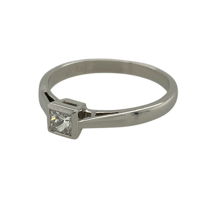 This pre-owned platinum diamond solitaire ring is a timeless classic, showcasing a beautiful princess cut diamond in a simple and elegant setting.

Design: The ring features a striking princess cut solitaire diamond, allowing the centre stone to take centre stage. The sleek platinum band complements the clean lines of the diamond, creating a sophisticated design that is perfect as an engagement ring or a cherished everyday piece.
Material: Made from platinum.