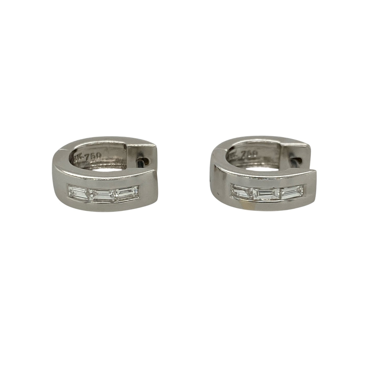 These pre-owned 18ct white gold diamond huggie earrings feature a stylish chunky profile, beautifully set with baguette cut diamonds for a sleek and sophisticated look.

Design: Each earring showcases a small chunky huggie design with three baguette cut diamonds set across the front, creating a clean, contemporary appearance. The polished 18-carat white gold complements the elegant diamond setting, making these earrings perfect for both everyday wear and special occasions.