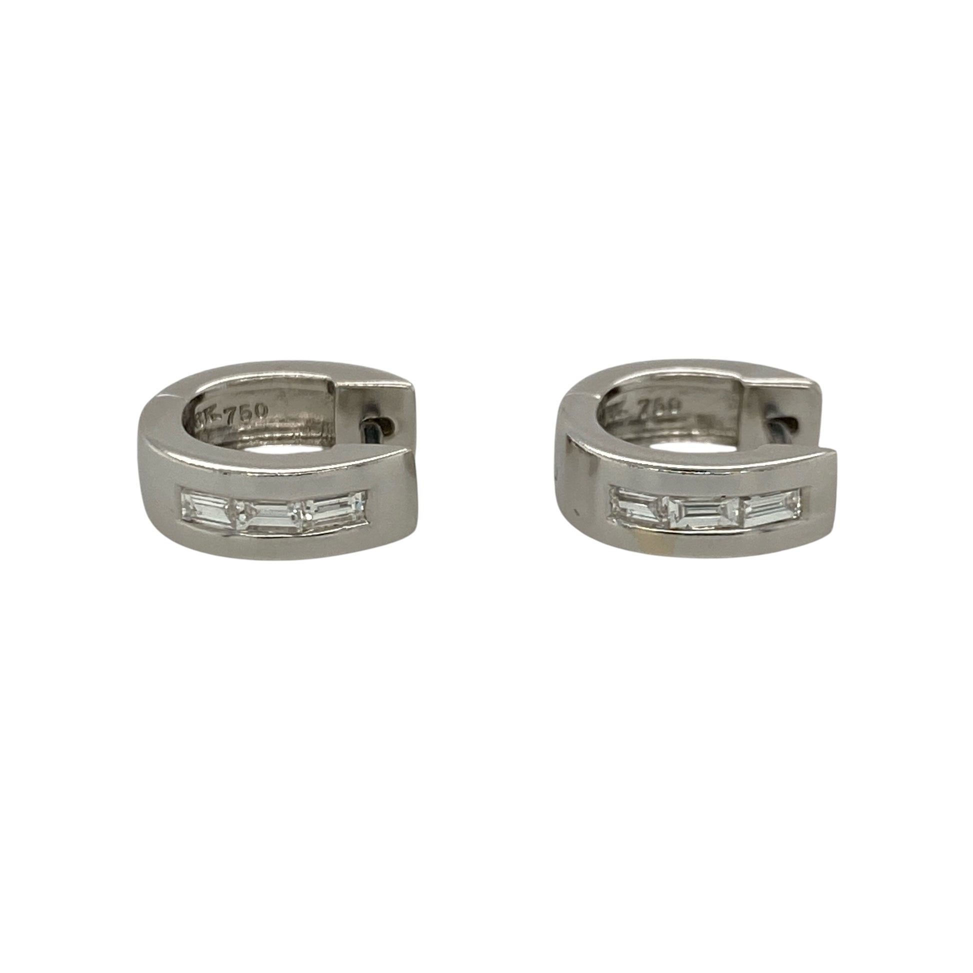 These pre-owned 18ct white gold diamond huggie earrings feature a stylish chunky profile, beautifully set with baguette cut diamonds for a sleek and sophisticated look.

Design: Each earring showcases a small chunky huggie design with three baguette cut diamonds set across the front, creating a clean, contemporary appearance. The polished 18-carat white gold complements the elegant diamond setting, making these earrings perfect for both everyday wear and special occasions.
