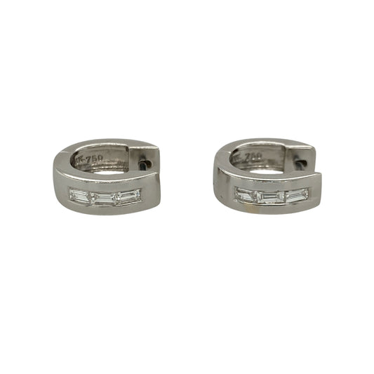 These pre-owned 18ct white gold diamond huggie earrings feature a stylish chunky profile, beautifully set with baguette cut diamonds for a sleek and sophisticated look.

Design: Each earring showcases a small chunky huggie design with three baguette cut diamonds set across the front, creating a clean, contemporary appearance. The polished 18-carat white gold complements the elegant diamond setting, making these earrings perfect for both everyday wear and special occasions.
