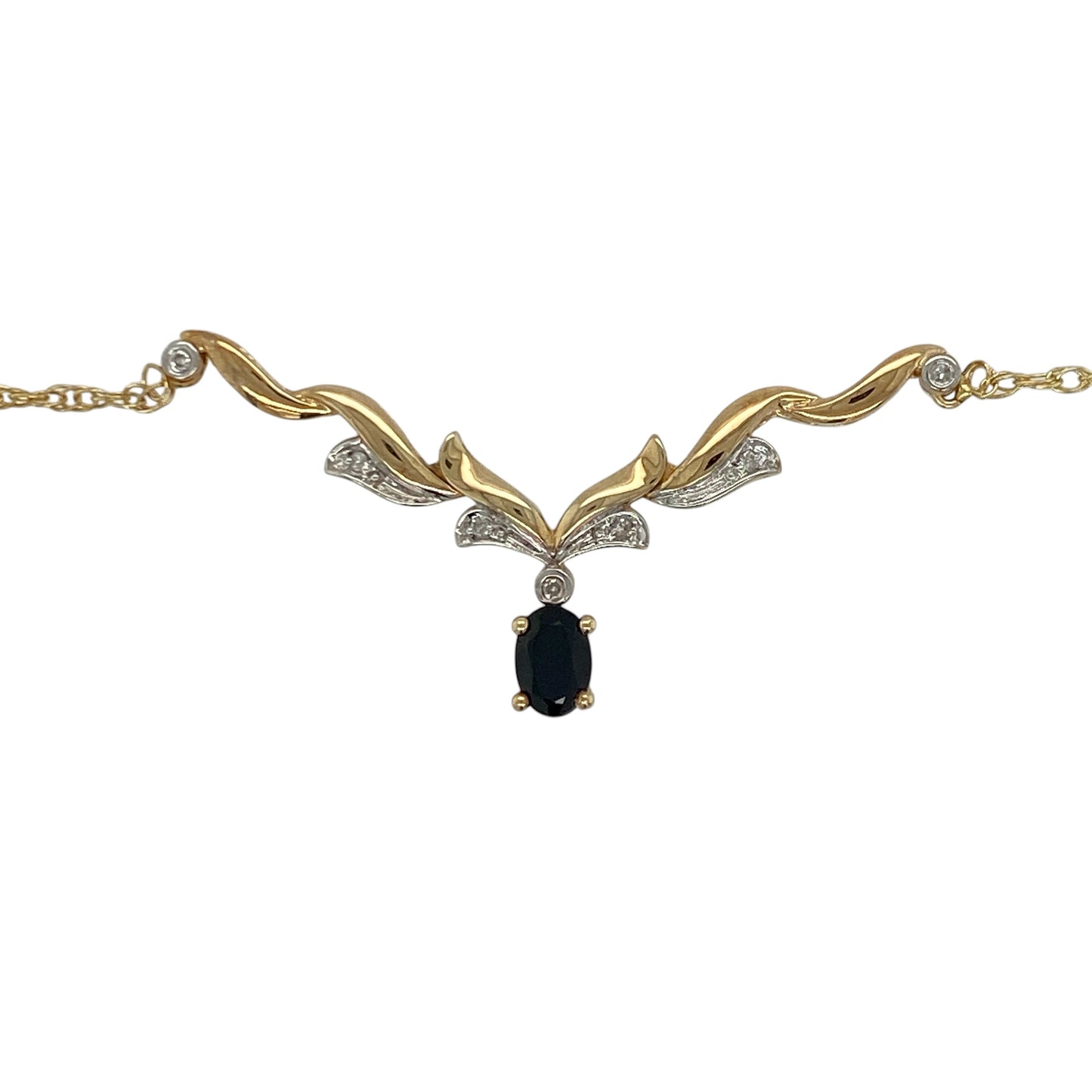 This pre-owned 9ct yellow and white gold diamond and sapphire Y-shaped necklace combines elegant two-tone gold with a timeless sapphire and diamond design.

Design: The necklace features a graceful Y-shaped design in polished yellow and white gold, centred around a vibrant oval sapphire accented by sparkling diamonds. Suspended from an 18-inch chain, it creates an elegant drop effect that is perfect for both everyday wear and special occasions.
Material: Made from 9-carat yellow and white gold.