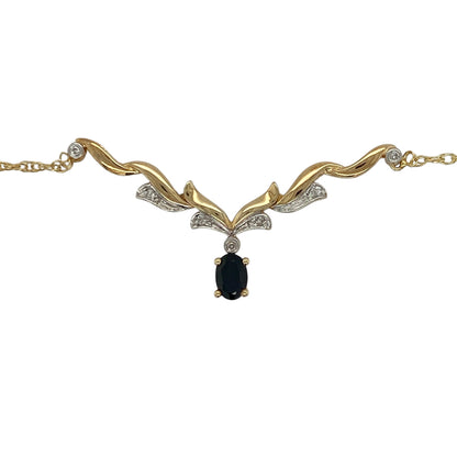This pre-owned 9ct yellow and white gold diamond and sapphire Y-shaped necklace combines elegant two-tone gold with a timeless sapphire and diamond design.

Design: The necklace features a graceful Y-shaped design in polished yellow and white gold, centred around a vibrant oval sapphire accented by sparkling diamonds. Suspended from an 18-inch chain, it creates an elegant drop effect that is perfect for both everyday wear and special occasions.
Material: Made from 9-carat yellow and white gold.