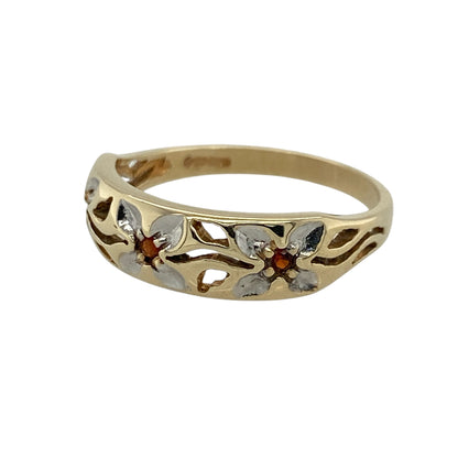 This pre-owned 9ct yellow and white gold garnet flower style band ring features a distinctive floral design with rich red garnets set across the front of the band.

Design: The ring showcases an elegant flower style design with deep red garnets beautifully set into a two-tone yellow and white gold band. The front of the band measures approximately 6mm wide, giving it a bold yet comfortable profile for everyday wear or special occasions.
Material: Made from 9-carat yellow and white gold.