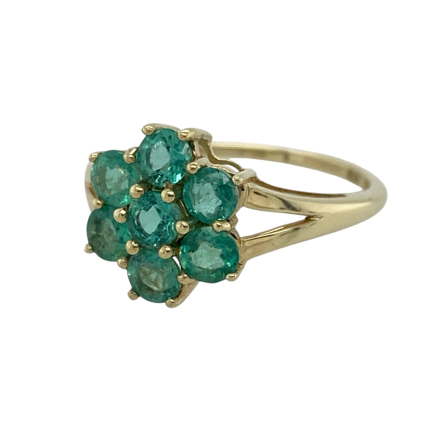 This pre-owned 9ct yellow gold green stone flower cluster ring features a timeless floral design with vibrant green stones for a fresh pop of colour.

Design: The ring showcases a delicate flower cluster design, with round green stones arranged to create an elegant floral effect. The polished yellow gold setting beautifully complements the vivid green stones, making it a lovely choice for both everyday wear and special occasions.
Material: Made from 9-carat yellow gold.