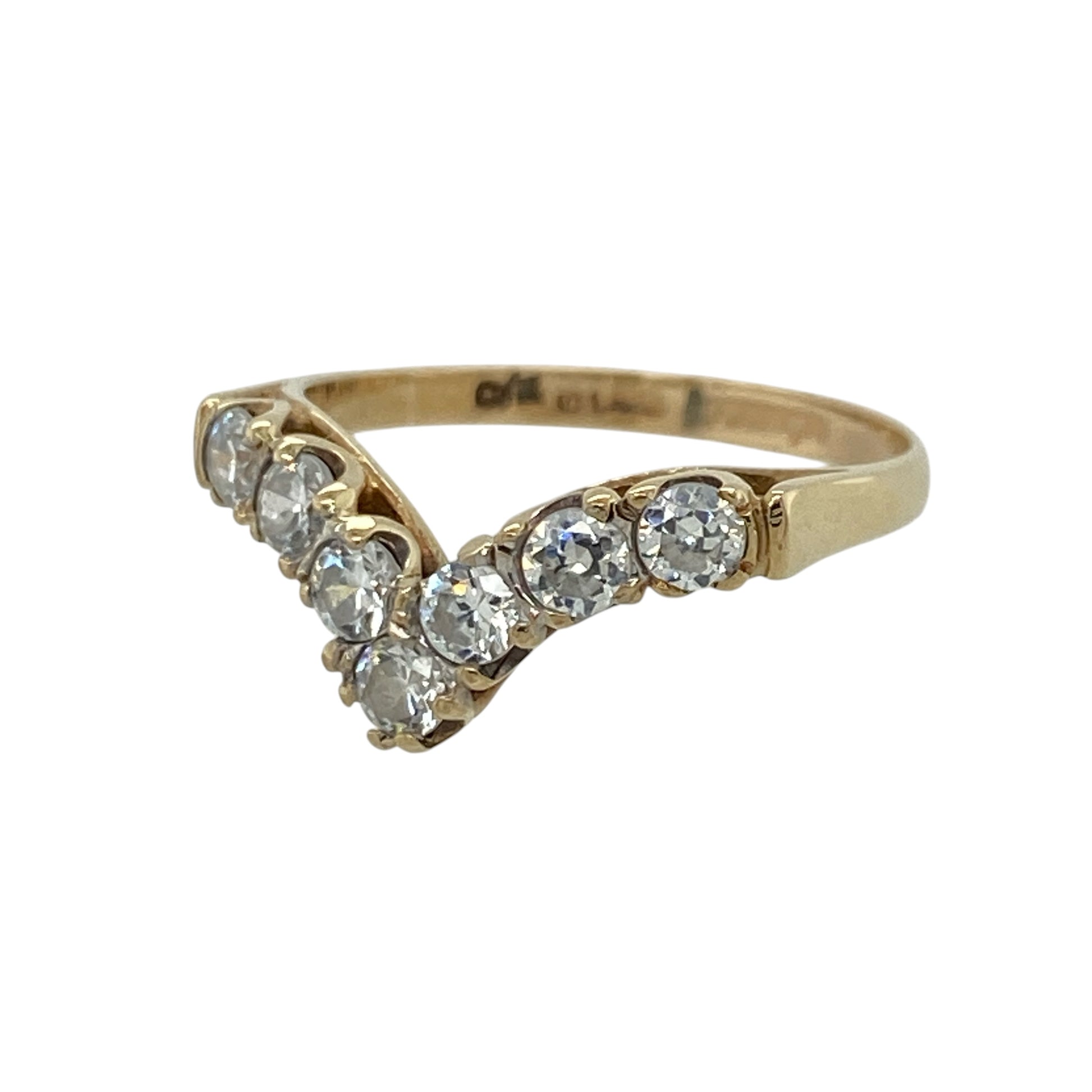 This pre-owned 9ct yellow gold cubic zirconia wishbone ring features a graceful V-shaped design, beautifully accented with sparkling cubic zirconias.

Design: The ring is styled in a classic wishbone shape, with shimmering round cubic zirconias following the elegant curve of the band. Its polished yellow gold finish creates a timeless look that is perfect worn alone or stacked with other rings.
Material: Made from 9-carat yellow gold.