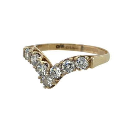 This pre-owned 9ct yellow gold cubic zirconia wishbone ring features a graceful V-shaped design, beautifully accented with sparkling cubic zirconias.

Design: The ring is styled in a classic wishbone shape, with shimmering round cubic zirconias following the elegant curve of the band. Its polished yellow gold finish creates a timeless look that is perfect worn alone or stacked with other rings.
Material: Made from 9-carat yellow gold.