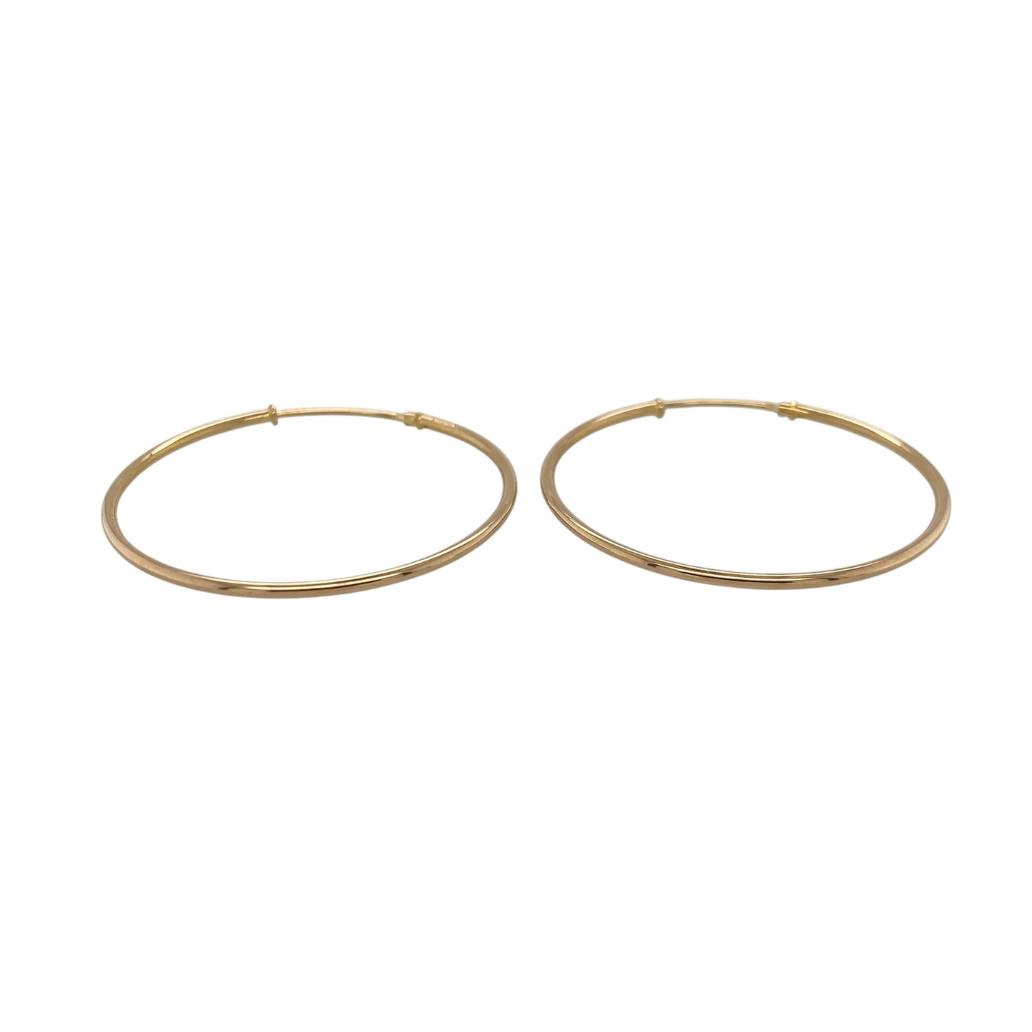 This pair of pre-owned 9ct yellow gold plain hoop earrings offers a timeless design that complements any jewellery collection.

Design: These classic plain hoop earrings feature a smooth polished finish for a clean and versatile look. With a generous 35mm diameter, they are perfect for everyday wear while making a stylish statement.
Material: Made from 9-carat yellow gold.
Earring Detail: Plain hoop earrings with secure hinged fastenings.
Size & Weight: Hoop diameter approximately 35mm.